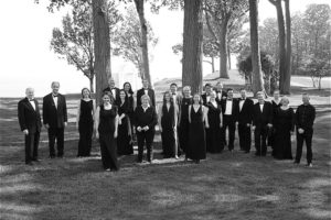 A group picture of The Elora Singers in black and white